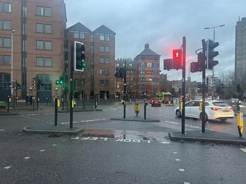 Busy City Intersection With Traffic Lights, Wet Streets Stock Photos