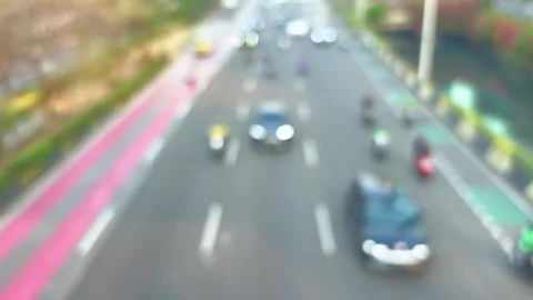 Busy city road with multiple lanes filled with numerous motor vehicles Video stock 344554346