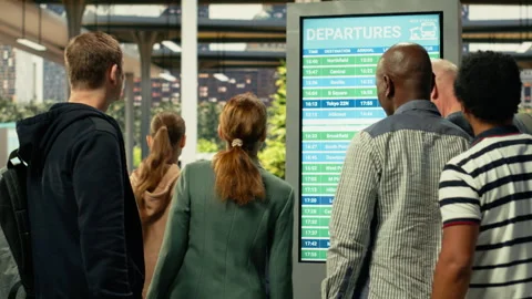 Busy coach station hall with multicultural people waiting for long-haul bus Stock Footage 334728414