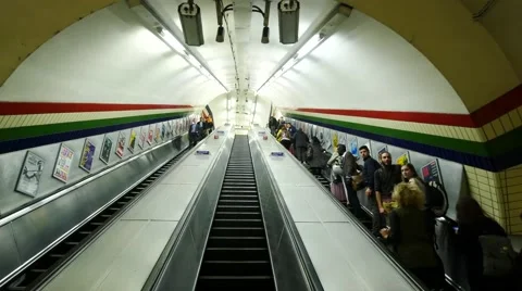 Busy commuters on elevators of an underground station in London Stock Footage 65007146
