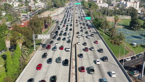Busy, congested, crowded car and truck traffic in Los Angeles freeway highway Stock Footage 273843878