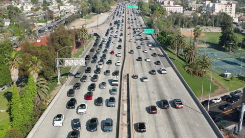 Busy, congested, crowded car and truck traffic in Los Angeles urban freeway Stock Footage 273844300