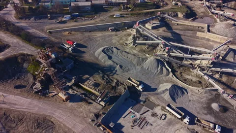 Busy construction site bustling with trucks and machinery, showcasing heavy Stock Footage 331267546