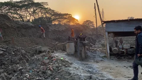 Busy Construction Workers Digging Earth at Sunset on Outdoor Site Stock Footage 341008019