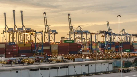 Busy container port during sunset. West Port, Malaysia. Timelapse Zoom Out Video stock 95878882