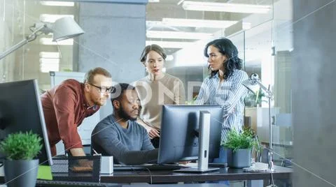 In Busy Corporate Office Team of Diverse Young Creative People Work on a Problem Stock Photos