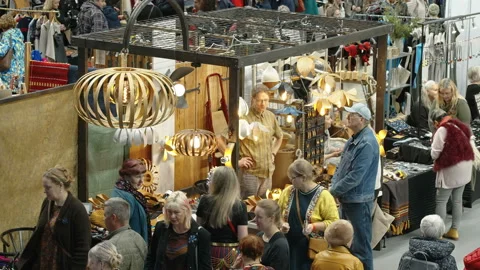 The busy craft fair inside the building in Tallinn Estonia Stock Footage 238856995
