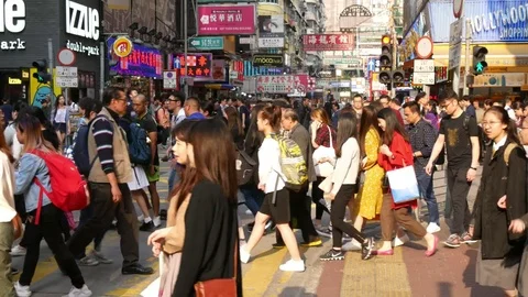  busy crossing intersection crowded with people passing in slow motion 스톡 동영상 78344977