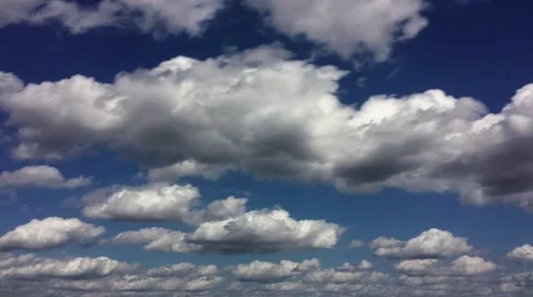 Busy cumulus cloud layers rolling left to right (2160p 23.976) Video stock 68402791