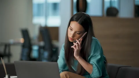 Busy developer answering call at sofa closeup. Manager watching laptop at office Video stock 228503199