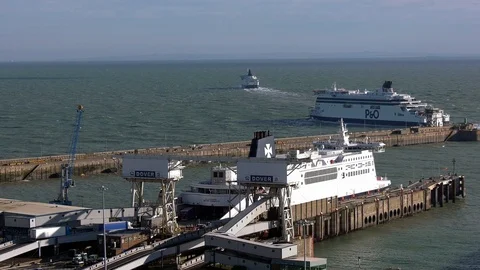 Busy Dover Port with ferry unloading whilst 2 exit docks for France Stock Footage 98276207