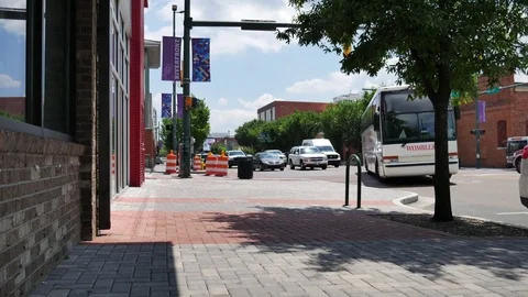 A busy downtown area with construction cones Stock Footage 76507138