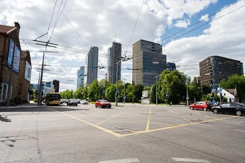 Busy downtown intersection with modern office towers and traffic in Vilnius.. Stock Photos