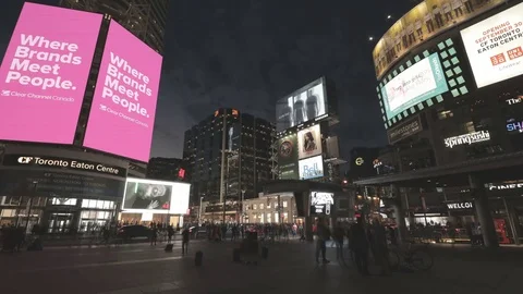 Busy downtown Intersection shot time lapse at night at Yonge-Dundas Square in To Video stock 70604045