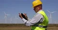 Busy Engineer Man Write Agenda Prospect Plan Block Notes Look Wind Turbines Farm 4k or 4k+ Resolution