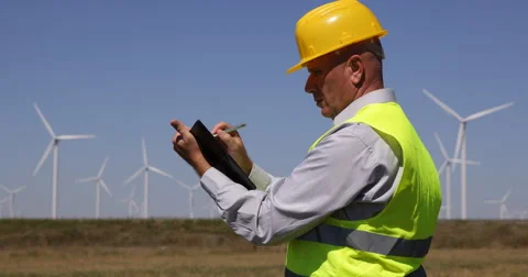 Busy Engineer Man Write Agenda Prospect Plan Block Notes Look Wind Turbines Farm Stock Footage 54655255
