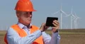 Busy Engineer Manager Planning Field Location Future Wind Turbine Farm Placement 4k or 4k+ Resolution