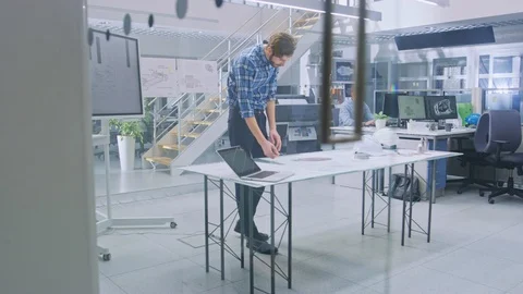 In the Busy Engineering Facility: Diverse Group of Engineers, Technicians Stock Footage 107776951