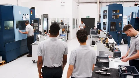 Busy Engineering Workshop With Workers Using CNC Machinery Stock Footage 95508818