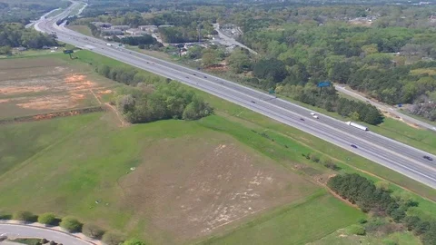 Busy Expressway Greentrees spring over head Stock Footage 129062268