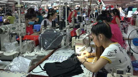 Busy factory floor, workers use sewing machines in Vietnam, Southeast Asia Stock Footage 61006863