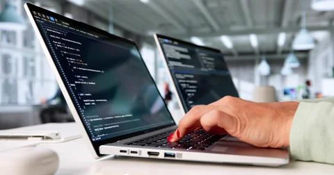 Busy Female Programmer Creating Software Code On Computer In Office. 写真素材