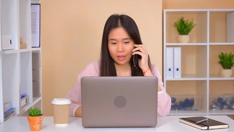 Busy female worker in the office Stock Footage 112095943