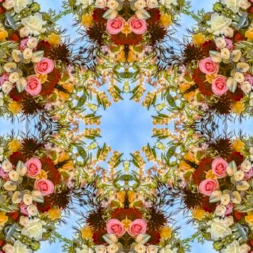 Busy floral design in a circular pattern with roses and other flowers Foto stock