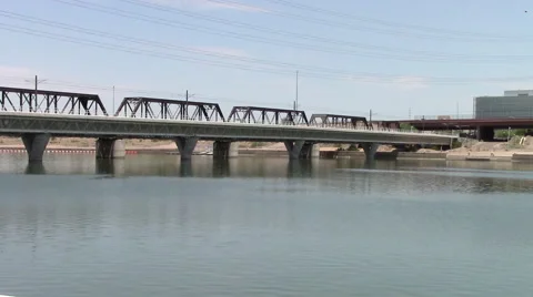 The busy freight train bridge is next to the light rail bridge. Stock Footage 53232310