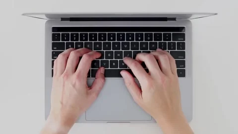 Busy hands typing on laptop keyboard. Computer hardware and software Video stock 248508702