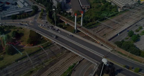 Busy highway intersecting railway tracks in urban area, animation of city Stock Footage 305066940