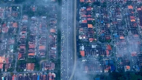A busy highway runs between two residential area. Stock Footage 129861816