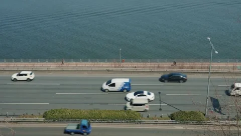 Busy Highway Traffic Next to River Stock-Footage 334694548