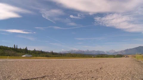 Busy highway traffic transport truck, mountains in BG, low angle Stock Footage