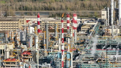 Busy industrial complex with active flares, detailed close-up of piping Stock Footage 270226785