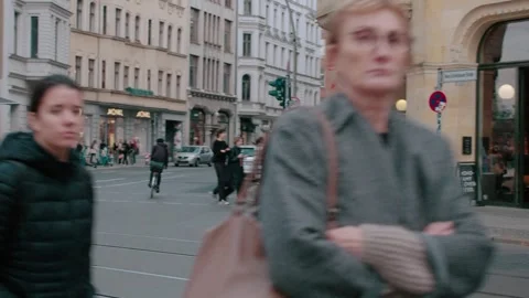 A busy intersection in Berlin. Lots of people crossing the road. Stock Footage 276374088