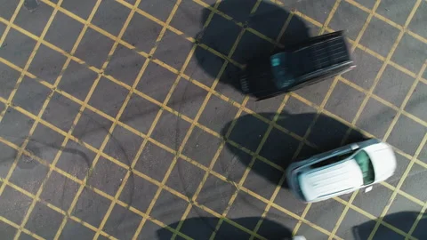 A busy intersection in a big city. The copter takes off over moving cars Stock Footage 137761293