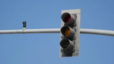 A busy intersection in California with traffic lights and palm trees agains.. Stock Footage 283715586