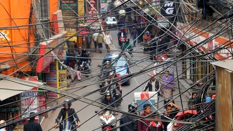 Busy intersection central Kathmandu Nepal pedestrians electrical lines crossing Video stock 119349965