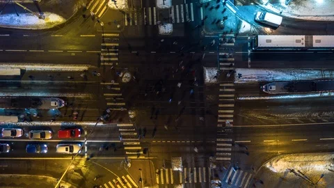 Busy intersection night aerial timelapse with pedestrians, cars, trams and buses Stock Footage 102189879