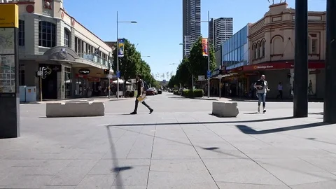 Busy intersection with pedestrians and traffic 4k Stock Footage 99423959
