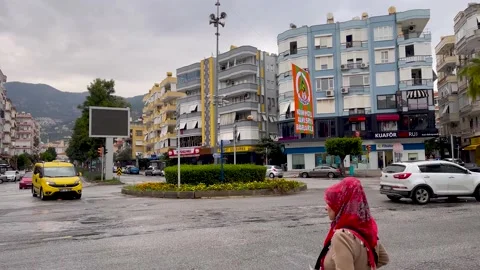 A busy intersection in a resort town on the southern coast of Turkey Stock Footage 166954417