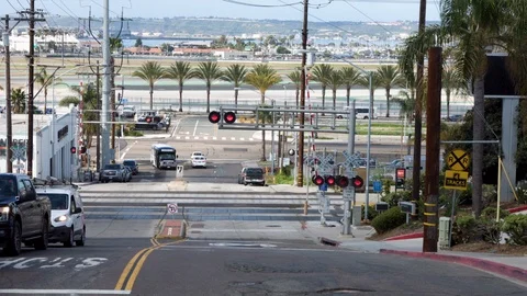 Busy Intersection In San Diego - Planes, Trolley, Trains, and Cars Stock Footage 107381625
