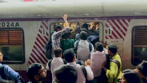 Busy local train station. Crowd move to board train. 4K Stock Footage 247891855