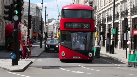 Busy London Street with buses, cabs and pedestrians Stock Footage