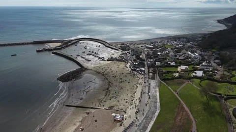Busy Lyme Regis Beach Overhead Drone Aerial View Devon UK Stock Footage 333680948