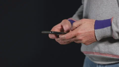 Busy man scrolling touchscreen on smartphone, checking business news online, Stock Footage 184026031