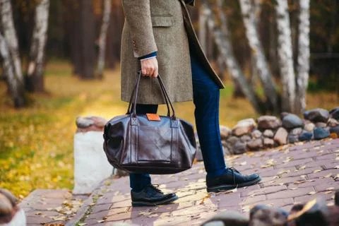 Busy man walking on street with briefcase Stock Photos