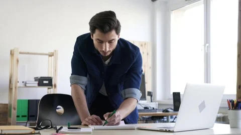 Busy man working in creative agency office Stock Footage 72870061