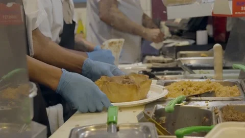 Busy Mexican restaurant kitchen assembling food Stock Footage 217814434